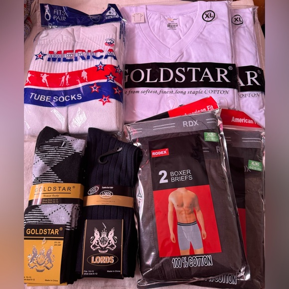 2 t shirts, 4 boxer briefs, 6 pairs tube socks, 6 pairs dress socks. - Picture 2 of 2
